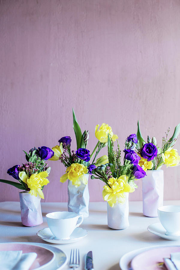 Spring Flowers In Three Vases Shaped Like Crushed Tin Cans #1 Photograph by Great Stock!