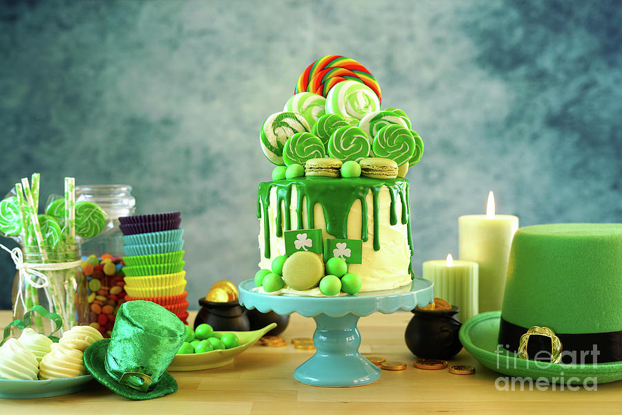 St Patricks Day candyland drip cake and party table. #1 Photograph by Milleflore Images