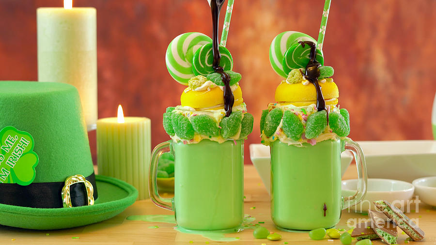 St Patricks Day on-trend holiday freak shakes with candy and lollipops. #1 Photograph by Milleflore Images