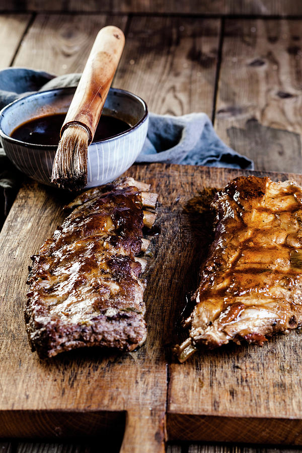 Sticky Spareribs With Homemade Bbq Glaze On A Oven Tray #1 Photograph by Susan Brooks-dammann