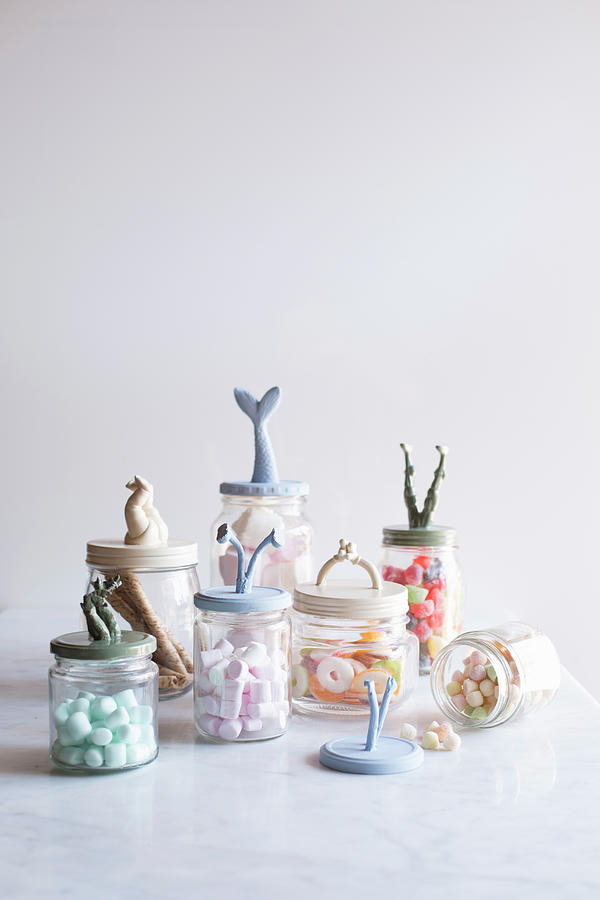 Storage Jars With Recycled Toys Decorating Lids #1 Photograph by Great Stock!