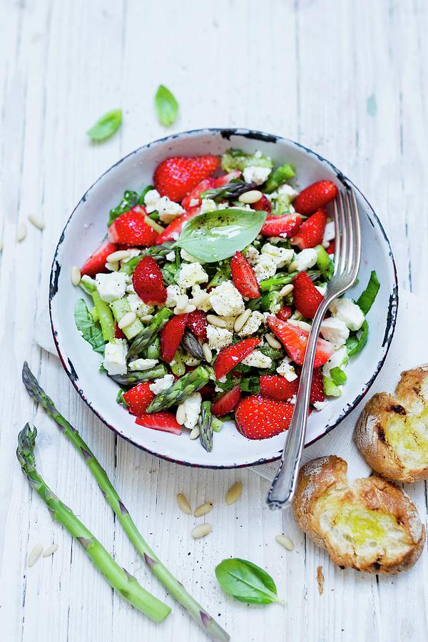 Strawberry And Asparagus Salad With Feta Cheese And Pine Nuts #1 Photograph by Brigitte Sporrer