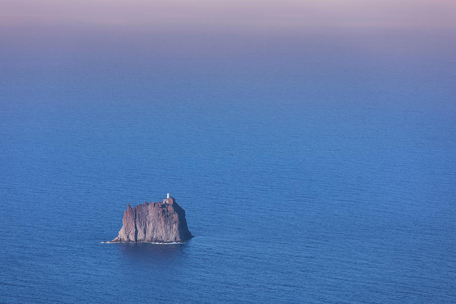 Strombolicchio Island With Lighthouse In Front Of Stromboli Volcanic Island In The Sea, Sicily Italy #1 Photograph by Bastian Linder