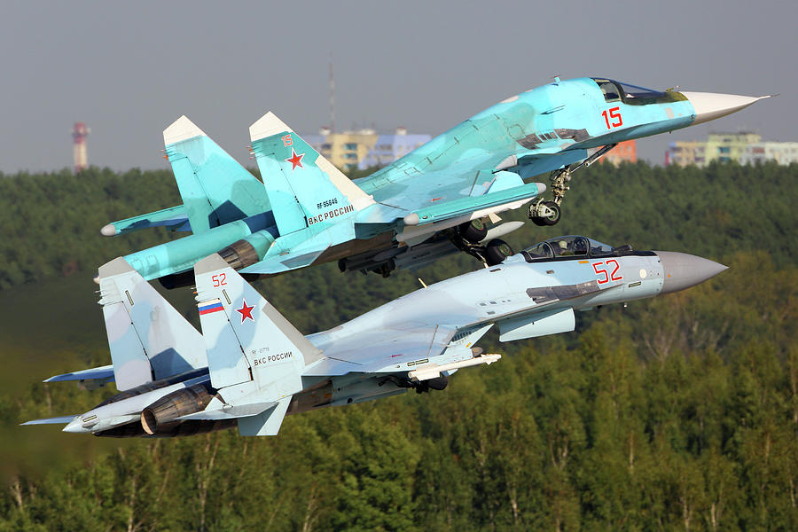 Su-35s And Su-34 Jet Fighters #1 Photograph by Artyom Anikeev
