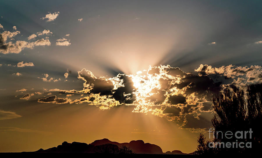 Sun And Crepuscular Rays Shining Through Clouds #1 Photograph by Stephen Burt/science Photo Library