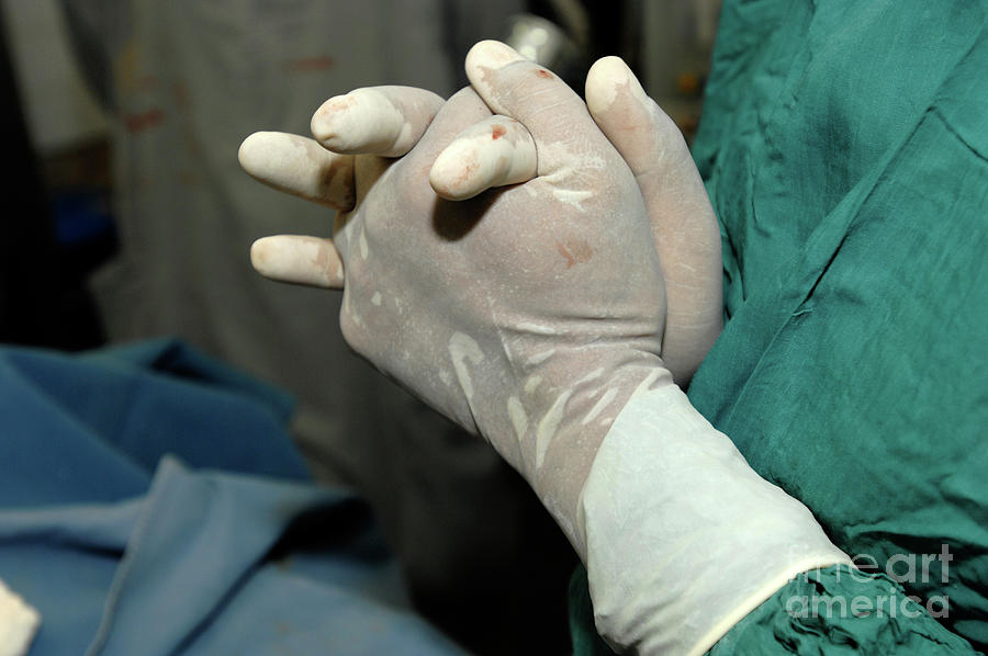 Surgeons Blood Stained Gloves. #1 Photograph by Medicimage / Science Photo Library