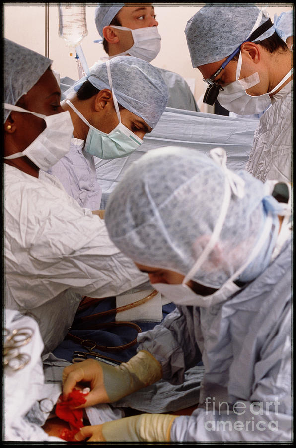 Surgeons Perform Quadruple Bypass Heart Operation Photograph by Michael