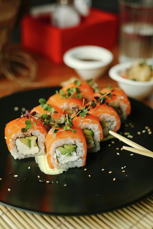 Sushi Rolls With Salmon, Avocado, Fresh Cheese And Herbs #1 Photograph by Kuzmin5d