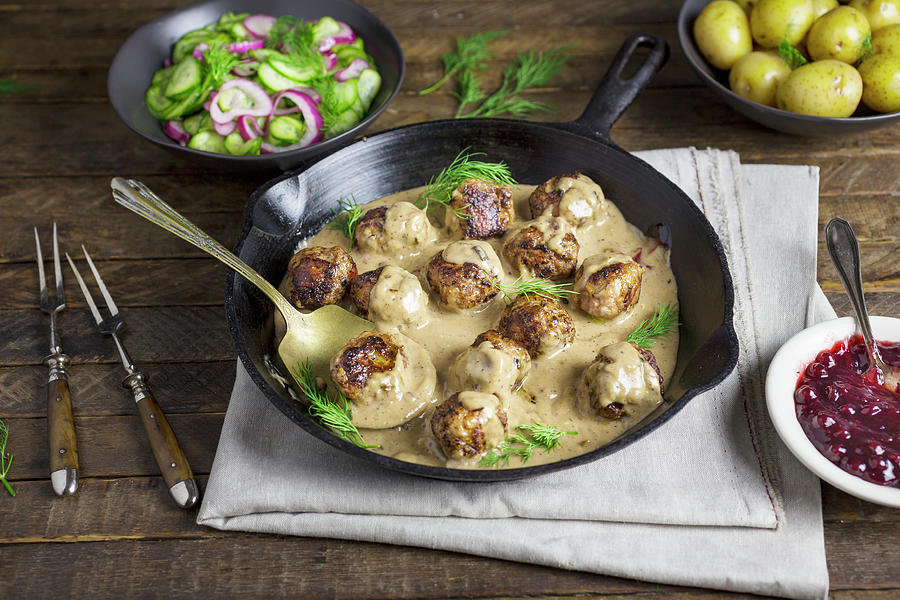 Swedish Meatballs In A Creamy Sauce With Cucumber Salad And New Potatoes #1 Photograph by Emily Clifton