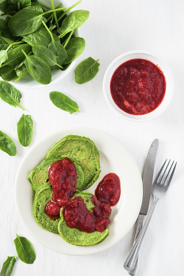 Sweet Spinach Pancakes With Strawberry Sauce #1 Photograph by Malgorzata Laniak