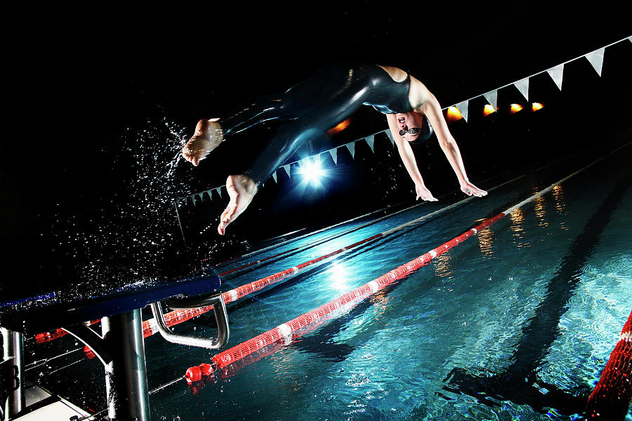 Swimmer Jumping From Starting Platform #1 Photograph by Stanislaw Pytel