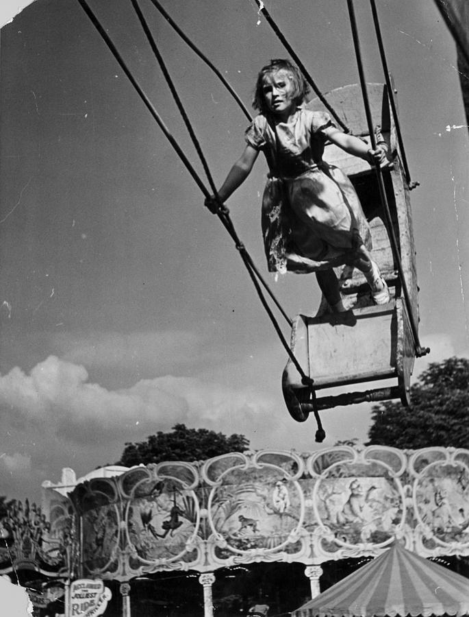 Swingboat Girl #1 Photograph by Kurt Hutton
