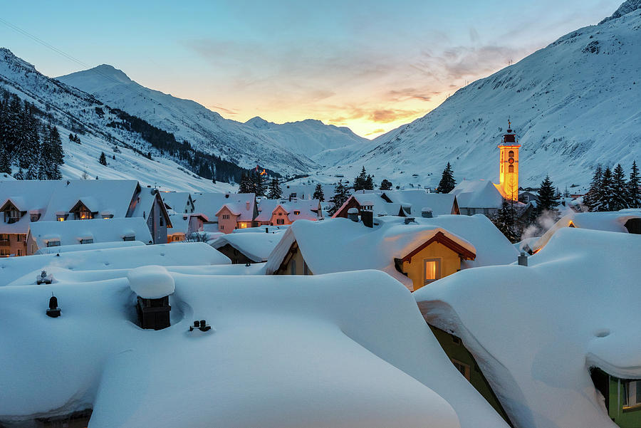Switzerland, Uri, Andermatt, Alps, The Alpine Village Of Andermatt In The Winter Evening #1 Digital Art by Alessandro Bellani