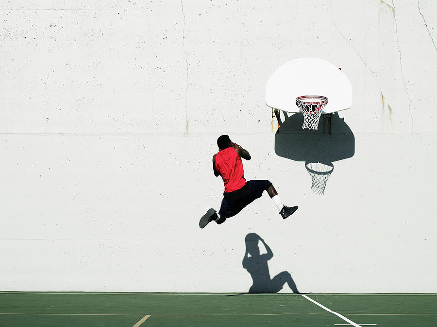 Teenage Boy 16-18 Dunking Basketball On #1 Photograph by Thomas Barwick