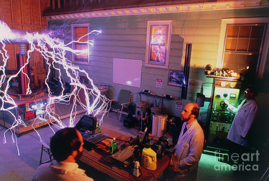 Tesla Coil Builders Assoc. With nemesis Coil #1 Photograph by Peter Menzel/science Photo Library