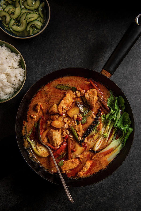Thai Massaman Chicken Curry With Peanuts, New Potatoes, Peppers, Pakchoi, Thai Lime Cucumber Relish And Jasmin Rice #1 Photograph by Magdalena Hendey