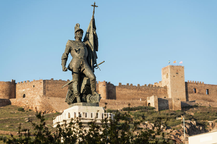 The Statue Of Courtly Hernan With Castle Of Medellin In The Background, Extremadura, Spainmedellin, Photograph