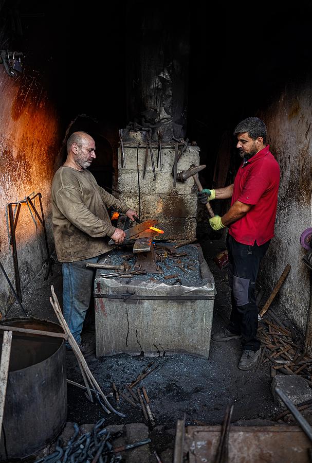 Men Photograph - The Traditional Blacksmithing #1 by Bashar Alsofey