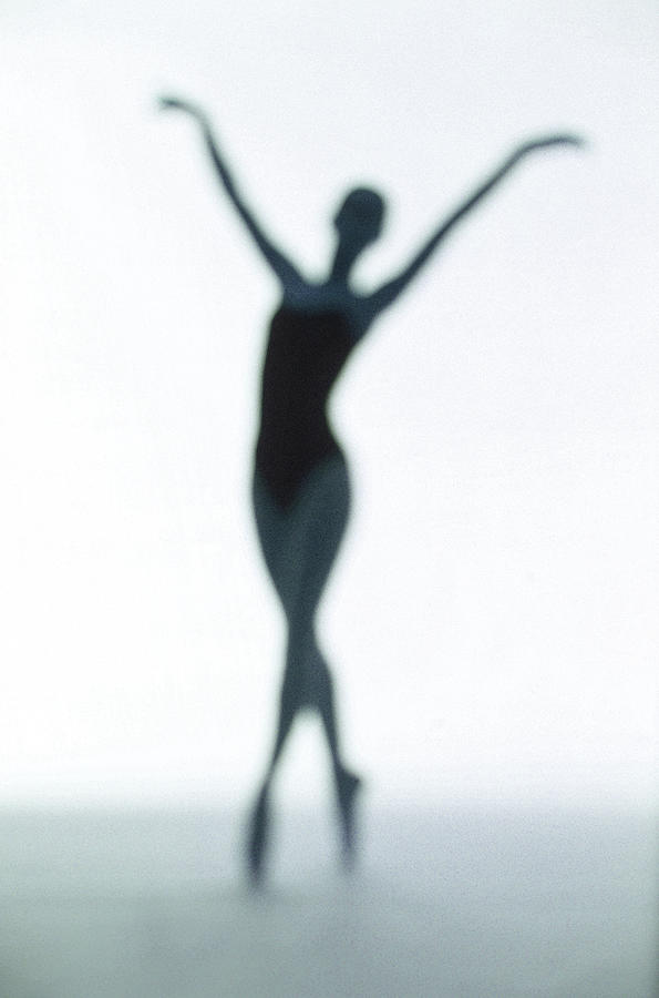Toned Silhouette Of A Young Woman #1 Photograph by George Doyle