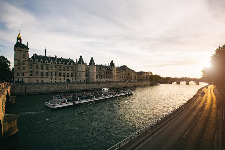 Sunset Photograph - Tourist Boat Tour On Seine River #1 by Prasit Rodphan