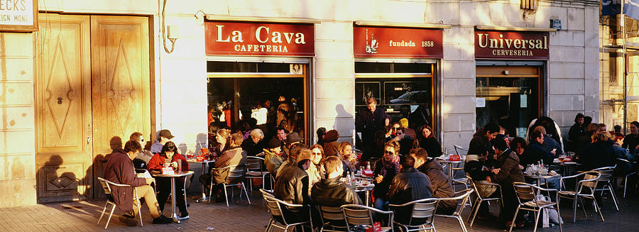 Tourists Sitting Outside Of A Cafe #1 Photograph by Panoramic Images
