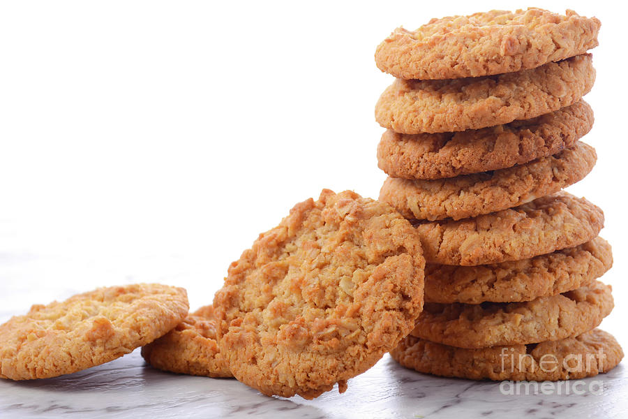 Traditional ANZAC Biscuits on White Background Photograph by Milleflore Images