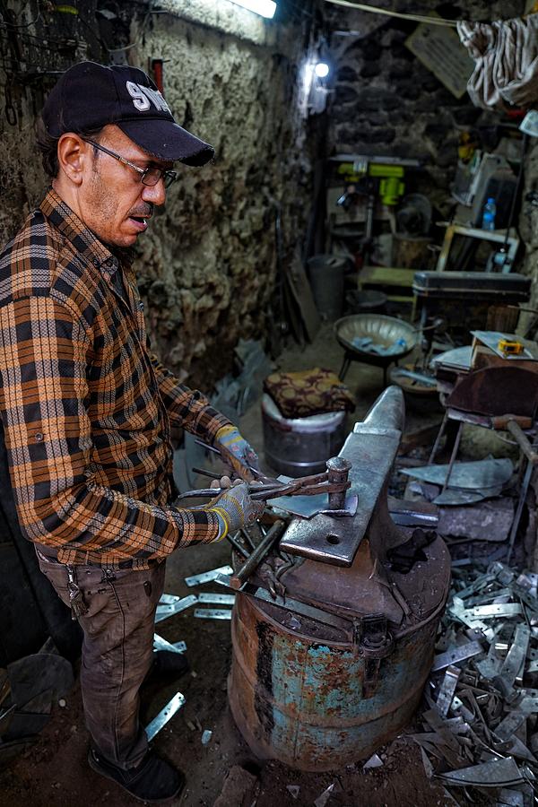 Man Photograph - Traditional Blacksmithing #1 by Bashar Alsofey
