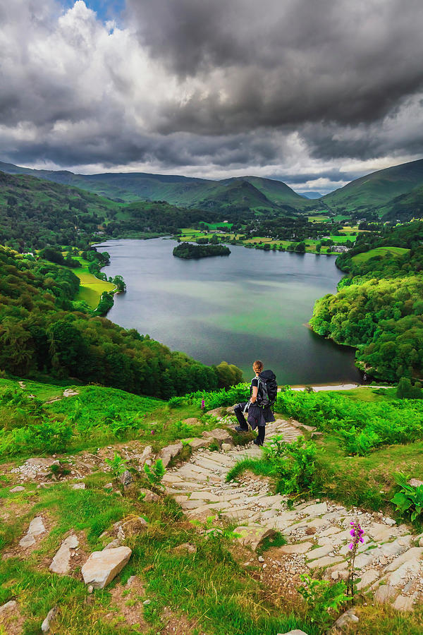 United Kingdom, England, Cumbria, Great Britain, Lake District, British Isles, A Woman Hiking The Hill Near Loughrigg Tarn And Enjoying The View Of The Lake From An Elevated Viewpoint #1 Digital Art by Maurizio Rellini