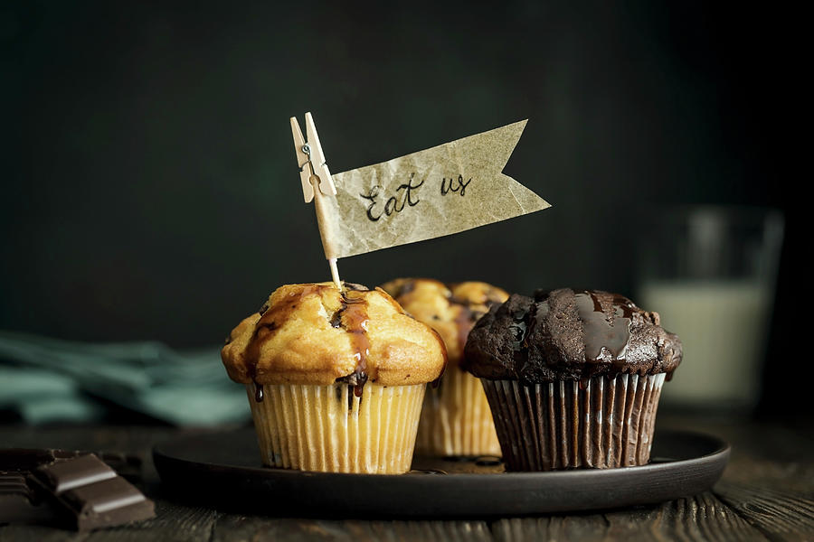 Vanilla And Chocolate Muffins With Chocolate Chunks And Paper Flags #1 Photograph by Valeria Aksakova