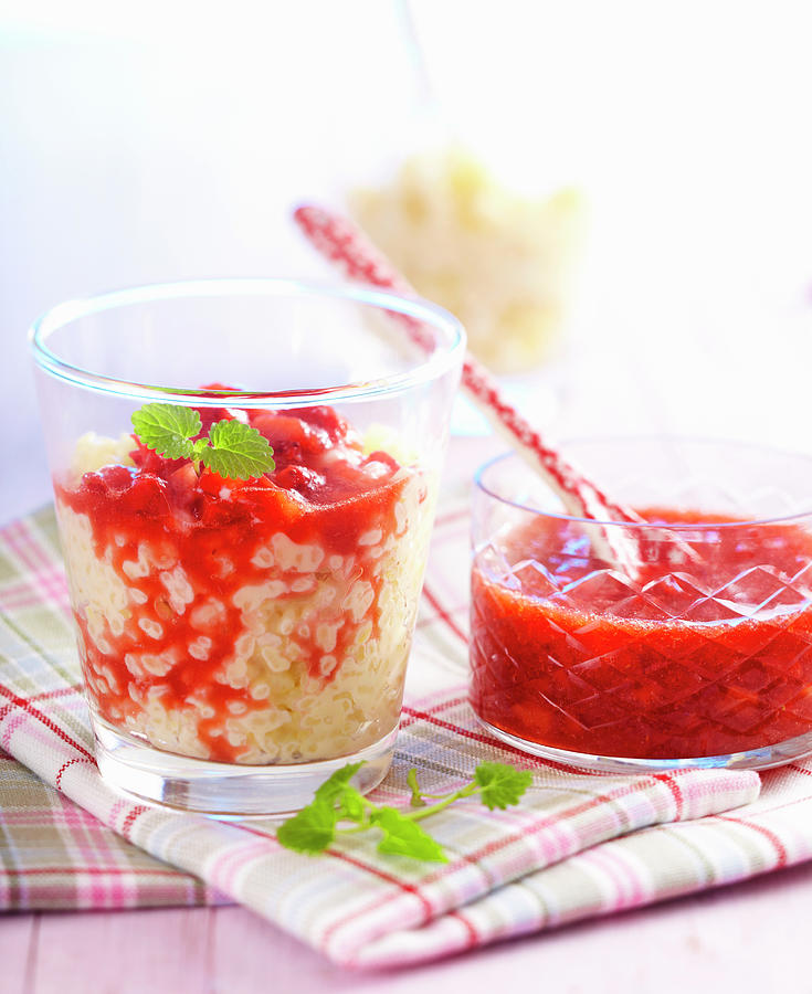Vanilla Rice Pudding With Strawberry Sauce In Small Glasses #1 Photograph by Teubner Foodfoto