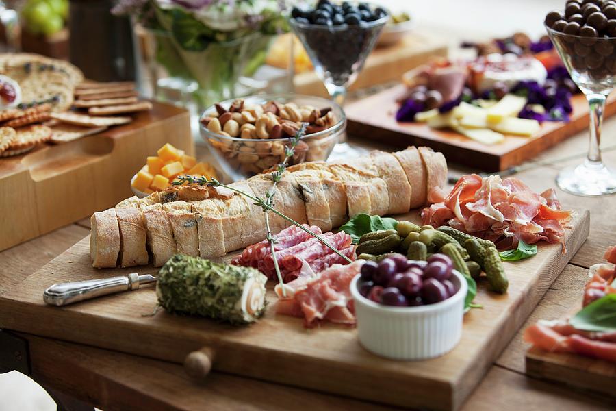 Various Party Snacks On A Wooden Table #1 Photograph by Creative Photo Services