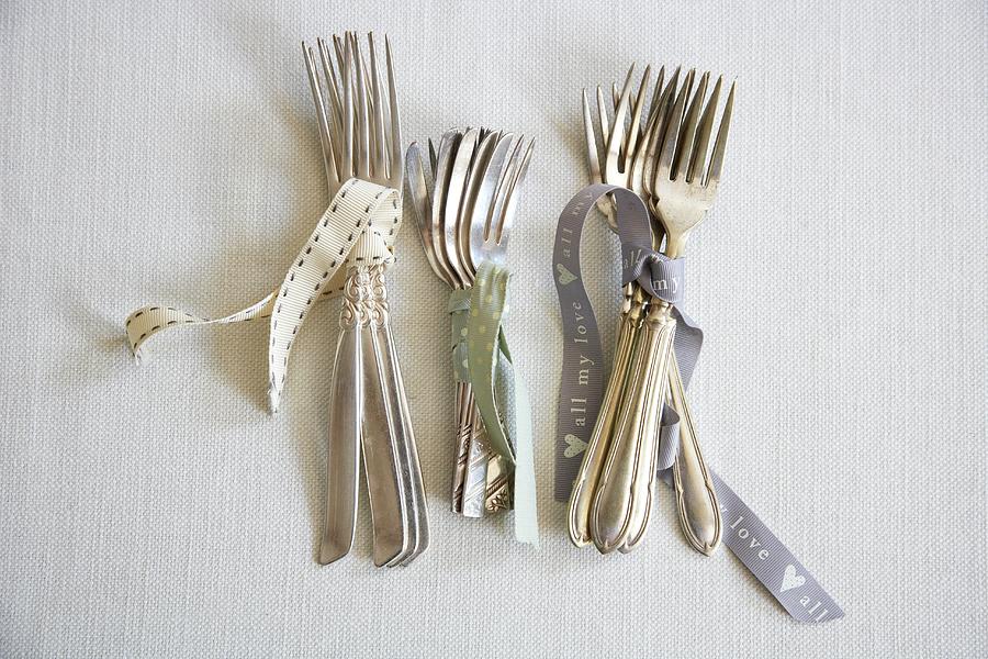Various Silver Spoons Tied Together With Ribbon #1 Photograph by Charlotte Murphy