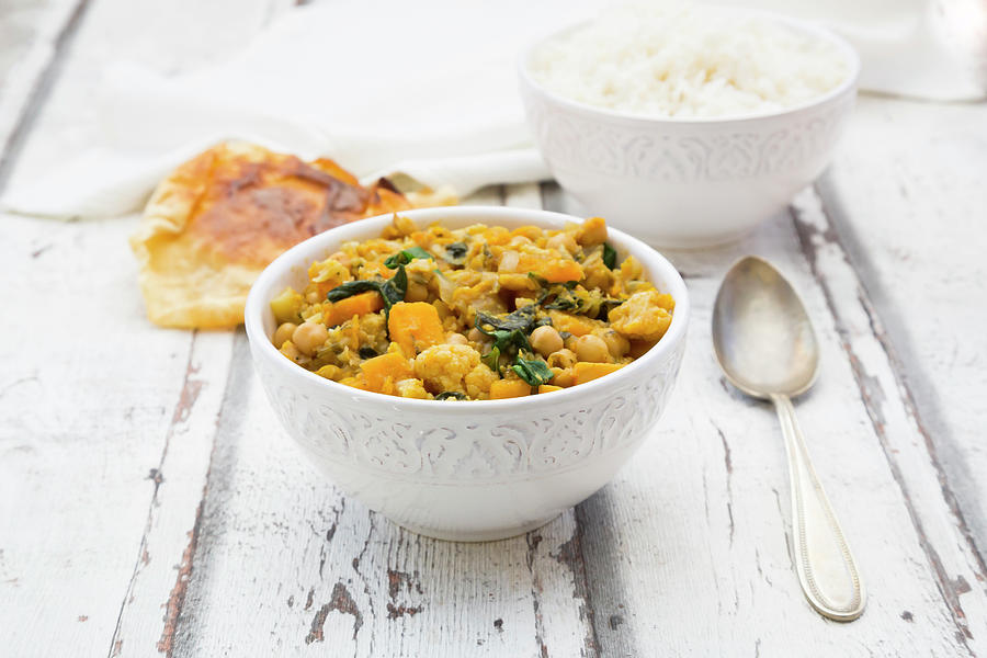 Vegetable Curry With Cauliflower, Butternut Squash, Spinach And Coriander Served With Poppadoms And Rice #1 Photograph by Larissa Veronesi