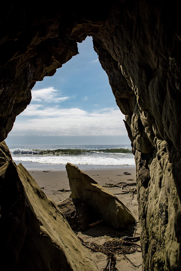 View Of Blue Ocean Out Of Coastal Cave Photograph by Cavan Images ...