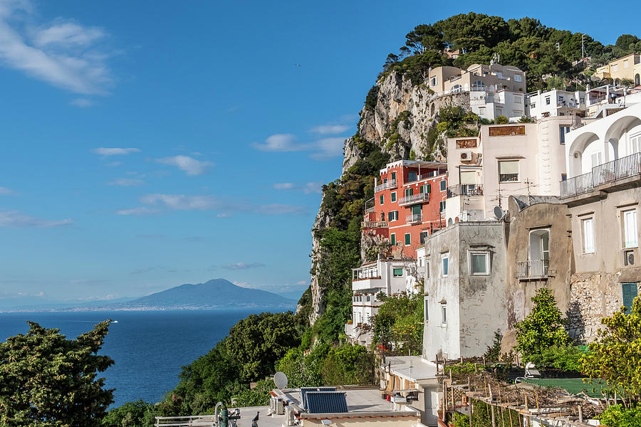 View Of Houses From Capri And Vesuvius In The Background, Capri Island, Gulf Of Naples, Italy #1 Photograph by Arnt Haug