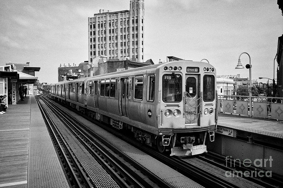 view of the blue line L train station at with train Damen Chicago IL