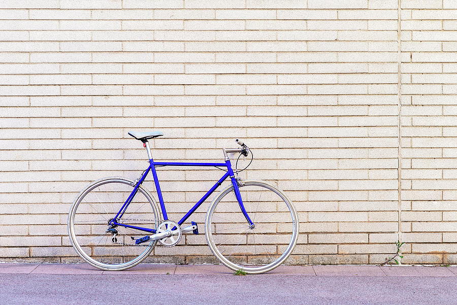 Vintage Blue Bike Leaning On A City Brick Wall Photograph by Cavan ...
