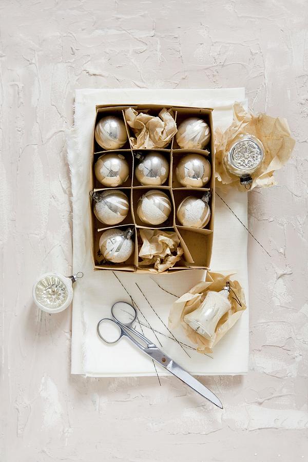 Vintage Christmas-tree Baubles In Old Cardboard Box #1 Photograph by Alicja Koll