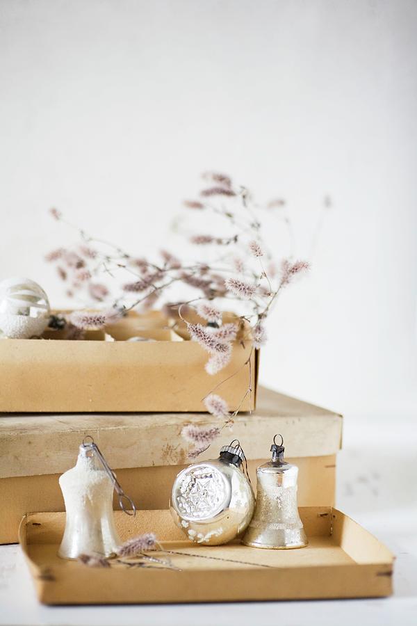 Vintage-style Christmas Baubles And Old Cardboard Box #1 Photograph by Alicja Koll