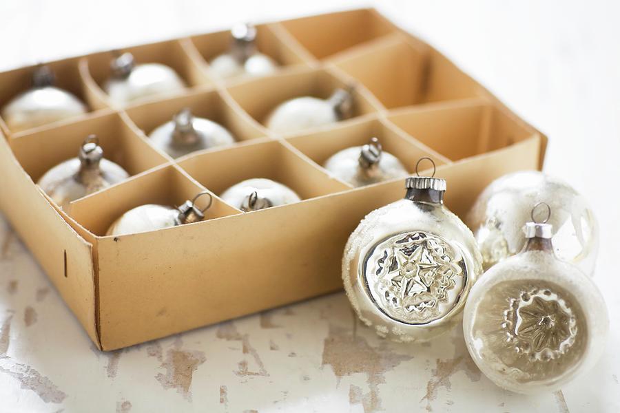 Vintage-style Christmas Baubles In Old Cardboard Box #1 Photograph by Alicja Koll