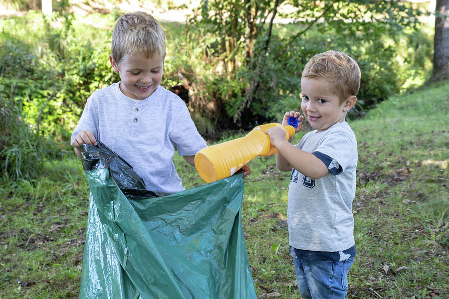 Volunteer Children Collecting Plastic Bottles With A Garbage Bag ...