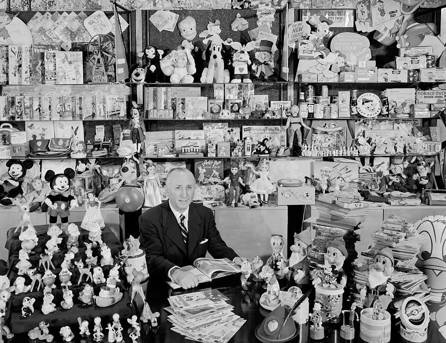 Walt Disneys brother, Roy Disney, sits proudly among some 3,000 of the 3,500 items which under his management, have been allowed to use Disney trademarks. #1 Photograph by Alfred Eisenstaedt