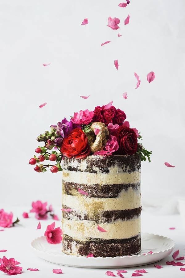 Wedding Cake With Buttercream, Flowers, And Gold Donuts #1 Photograph by Rose Hewartson