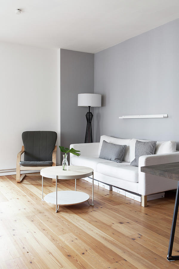 White Sofa, Armchair And Round Coffee Table In Grey-and-white Living Room #1 Photograph by Hej.hem Interior