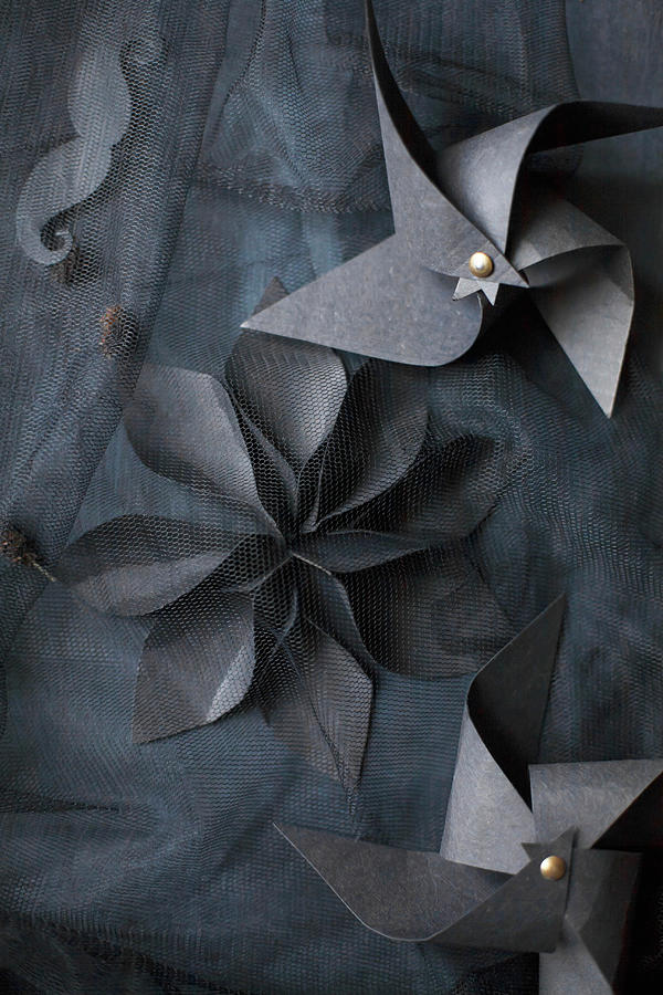 Windmills And Flower Made From Black Paper On Black Fabric #1 Photograph by Alicja Koll
