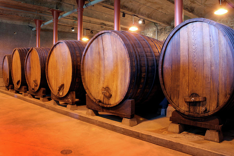 Wine Barrels In Winery Cellar Of Napa #1 Photograph by Yinyang