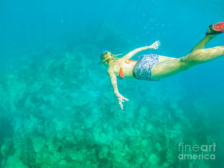 Woman apnea snorkeling #1 Photograph by Benny Marty