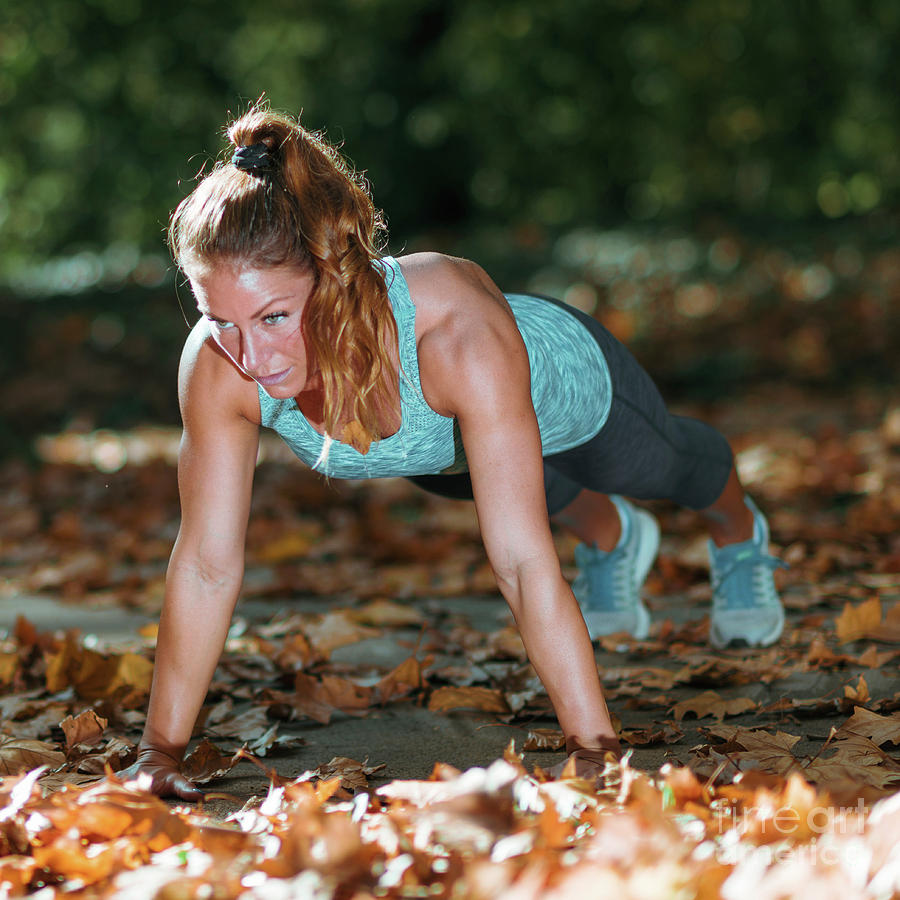 Woman Doing Push Ups In The Park #1 Photograph by Microgen Images/science Photo Library