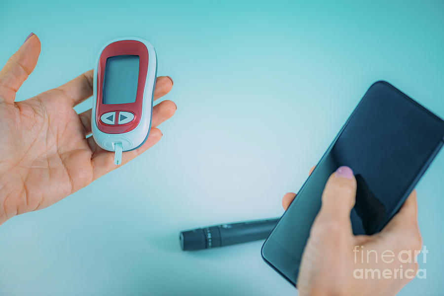 Woman Entering Glucose Level Data Into App Photograph by Microgen ...