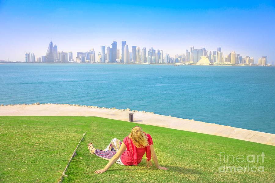 Woman looking Doha Skyline #1 Photograph by Benny Marty